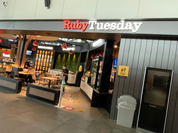 The lounge is opposite Ruby Tuesday.