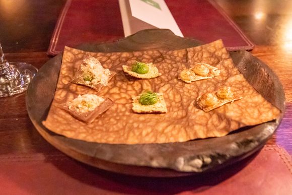 Snacks, course #1. I think these are, from left to right: rye with horse mussel; leek & goose; and cod & roasted onion.  Paired with a glass of Christophe Mignon Brut Nature (extra 3000 kr).