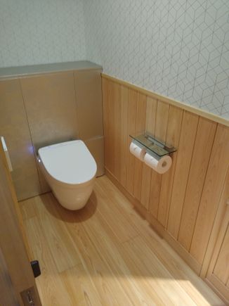 Small toilet room, near the entrance to the suite; i.e., about as far from the bedroom as it is possible to get. LOL