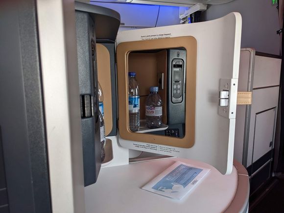 Console cupboard - weirdly, the headphones are hardwired into this. You can also see how in this row the console creates a buffer to the aisle.