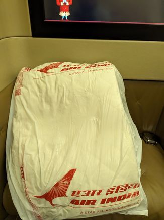 Most definitely not First Class.  Also not Business. Actually, even poorer than economy!