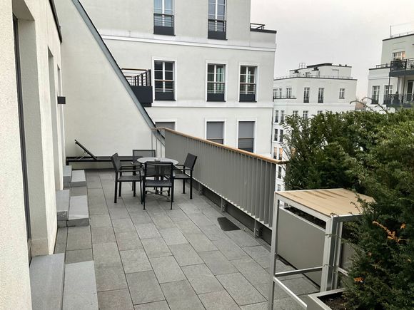 Total length of balcony seen from bathroom 1 past kitchen towards living room 