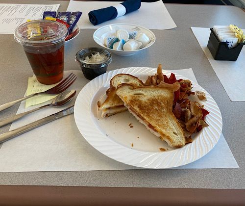 Turkey and bacon grilled cheese with chips and cole slaw for lunch. 