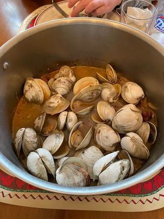 Portuguese clams. Linguica, onions, white wine, and the last batch's strained broth.