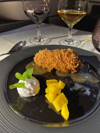 Deep fried banana with coconut sauce