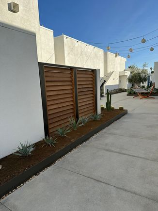 Various courtyard rooms and suites around the second floor have a small private outdoor area which is enclosed by a fence like this.