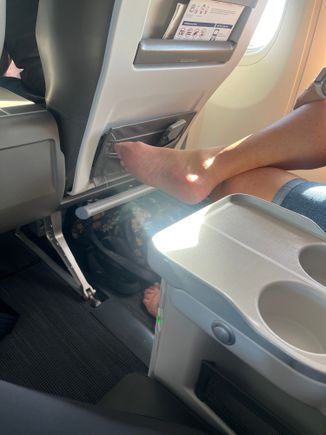 If that isn’t enough, next she decides it is a good idea to start picking the skin off her disgusting feet and cleaning between her toes. I almost puked. Lady, get a pedicure and leave your freaking shoes on in public. So now her fingers have been all over the same feet that were on the airplane floor.