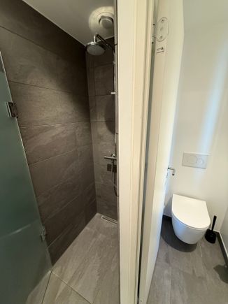 The shower is a bit small, but completely fine with good water pressure