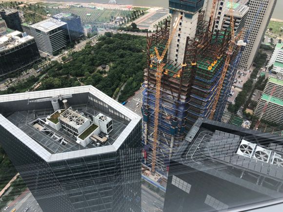 I will add to the construction photos. This taken from the top floor of IFC Tower 3 just a few days ago. 