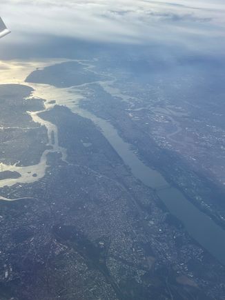 Looking back at Manhattan after we finally passed the thin cloud layer lingering over the city. 