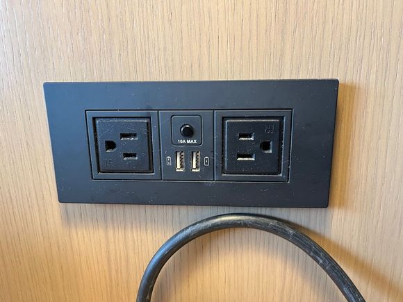 Wall outlet above both nightstands, with  AC and USB-A outlets.