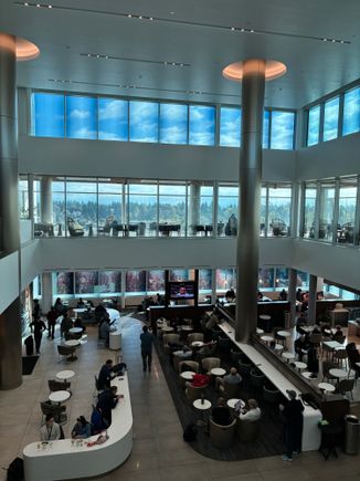 View from the D1 lounge level looking at the SkyClub below and at the Sky Deck across the floor 