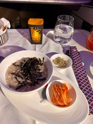 Beef and mushroom porridge with dried anchovies seaweed and kimchi - this was excellent 9/10.