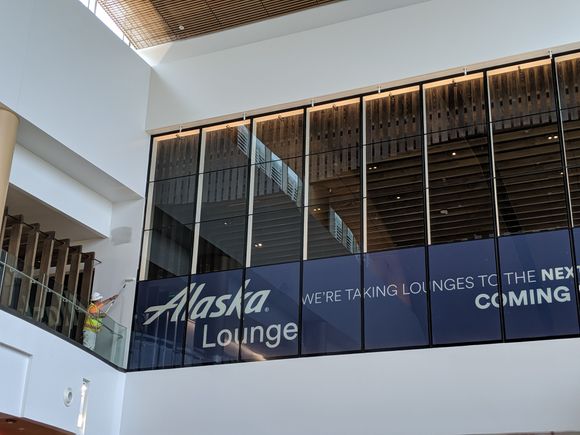Putting the finishing touches on the new AS Lounge above gate N13 at SEA's North Satellite. Photo taken 7/2/19. Scheduled to open 7/12/19.