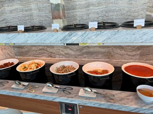 Further down on your way to the back of the restaurant where the bar and coffee is