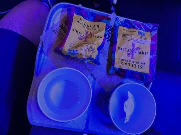 AS 143SEA-DEN  8:00 PM departure

Water and pretzels at our seats at boarding. Nothing else offered.