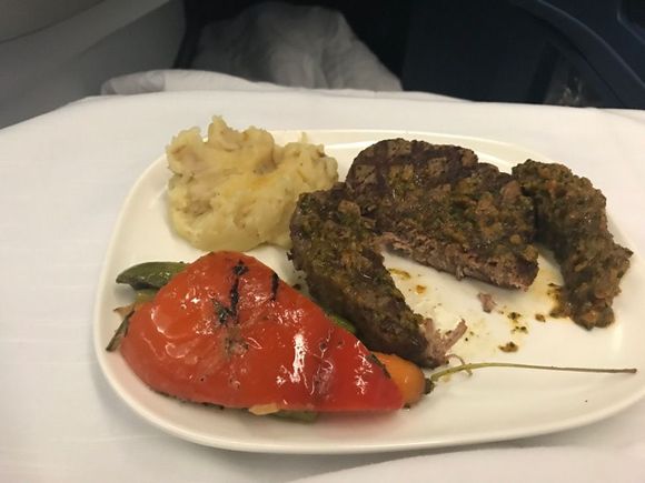 My beef was beyond well-done and had consistency more like a hamburger than a steak. My wife's was cooked medium and looked much better. Neither of us liked the "salsa" and from the looks of the trays returning to the galley, many others scraped it off and didn't eat it either.