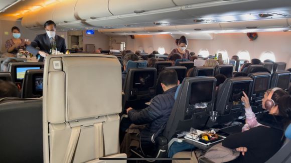 Meal service was still in swing downstairs in the economy cabin