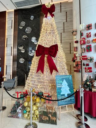 Lobby level Christmas tree made with 2500+ water bottles, looks like the bottles they have in the room.