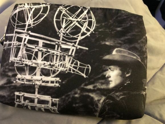 Typical goodie bag in place at boarding (along with water bottle and wrapped pillow/blanket.)