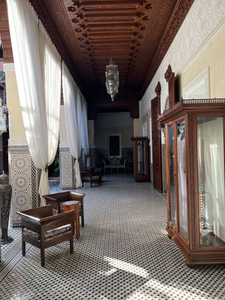 At the Main Lobby, Arcades in the shade. Extraordinary woodwork on the ceiling and marble carvings. 