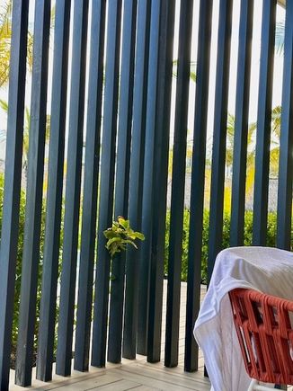 Slats showing neighbor's deck in swim up room