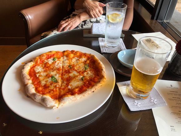 Pizza baked in club lounge's pizza oven