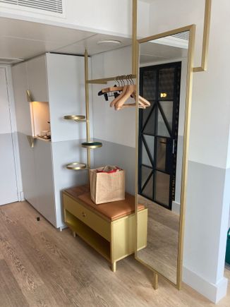 Left of the entry is the open wardrobe space