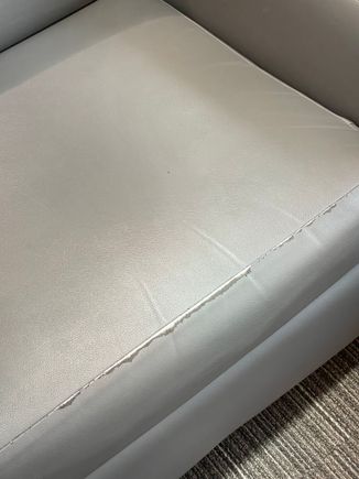 Worn "pleather" seating throughout.