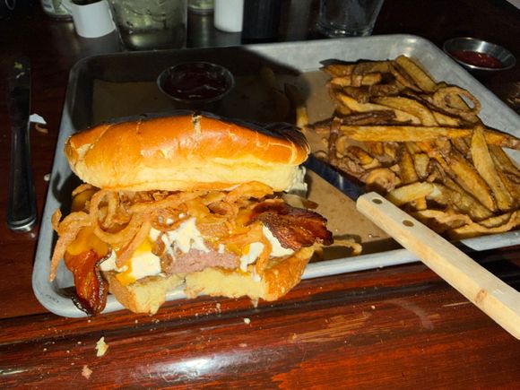 Giant black and blue burger with back and onion straws 
At the Black Cow Fat Pig in Norfolk NE