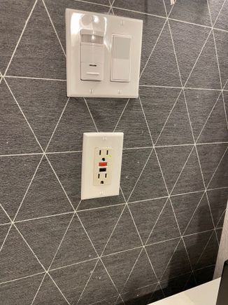 Numerous toothpaste(?) stains in the bathroom 