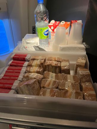 interesting snack basket from NRT. Did not partake as I dislike tuna. was Tuna and Cheese sandwiches. Additionally the regular snack bin was up front (kitkats, gummy bears, Miss Vickie Chips)