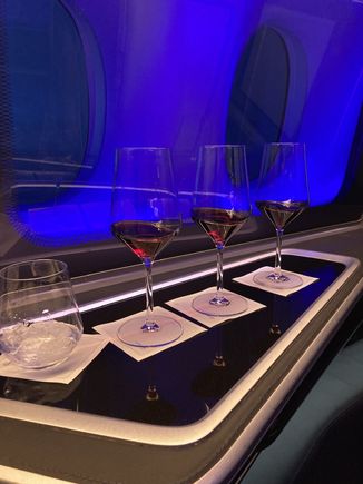 Red wine flight.  Suggested by the stewardess… I’d forgotten how good/different it is when you get a crew with experience and confidence and they want to have fun too…