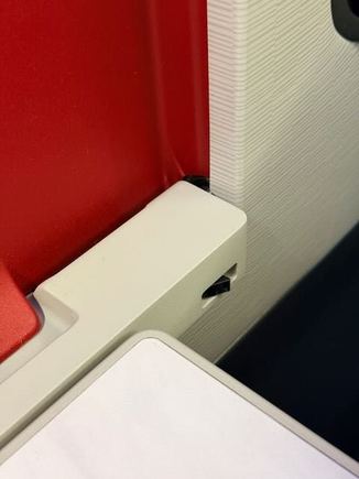 Tray table mechanism which forces the table to be back in position before folding up. They should have a mechanism to prevent sagging too.