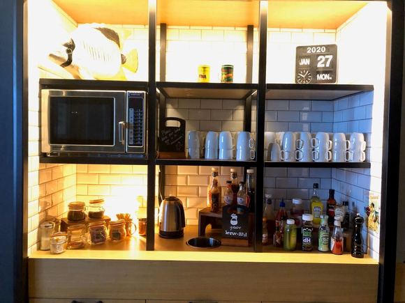 Microwave and some food prep area