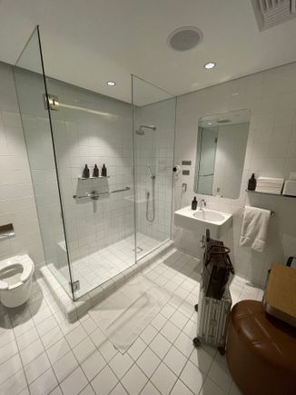 Shower Number 1: Quantas F lounge. Tiles are abit old in design, but did the trick. Wished there was more space or luggage rack to put the luggage on. There is an ottoman though, and did the trick!