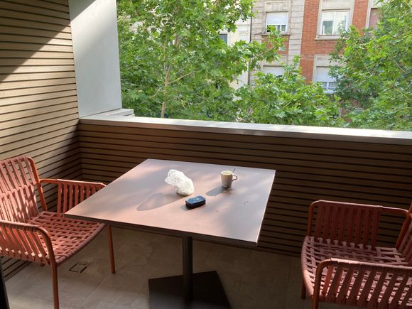 Spacious covered balcony facing east 