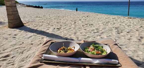 Lunch on the beach, squid skewers and side salad