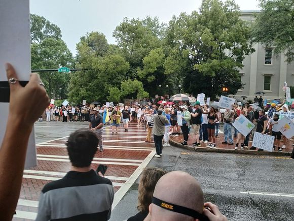 Ah, but about 30 minutes in we got the rain that DC should have gotten. The crowd didn't leave, though they walked a few steps to the other side of the square to hear the speakers.