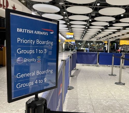 This sign has done more harm to faster boarding than any other tinkering in recent memory. Quite rightly 60 to 100 people will stand infront to the tensa barriers waiting for boarding to commence. Another 20 or 30 people will stand behind them  meaning the gate is completely gridlocked. A late arriving group one has no chance.