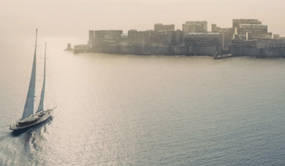 James Bond sailing to Gunkanjima in Skyfall