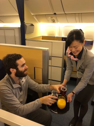 The Mr. looking like he is a posing for an ANA ad (and one of our lovely FA's!). 