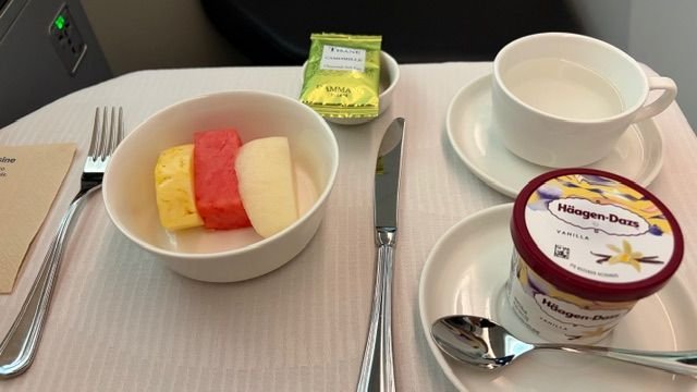 Sliced fruits, Haagen Dazs ice cream, tea