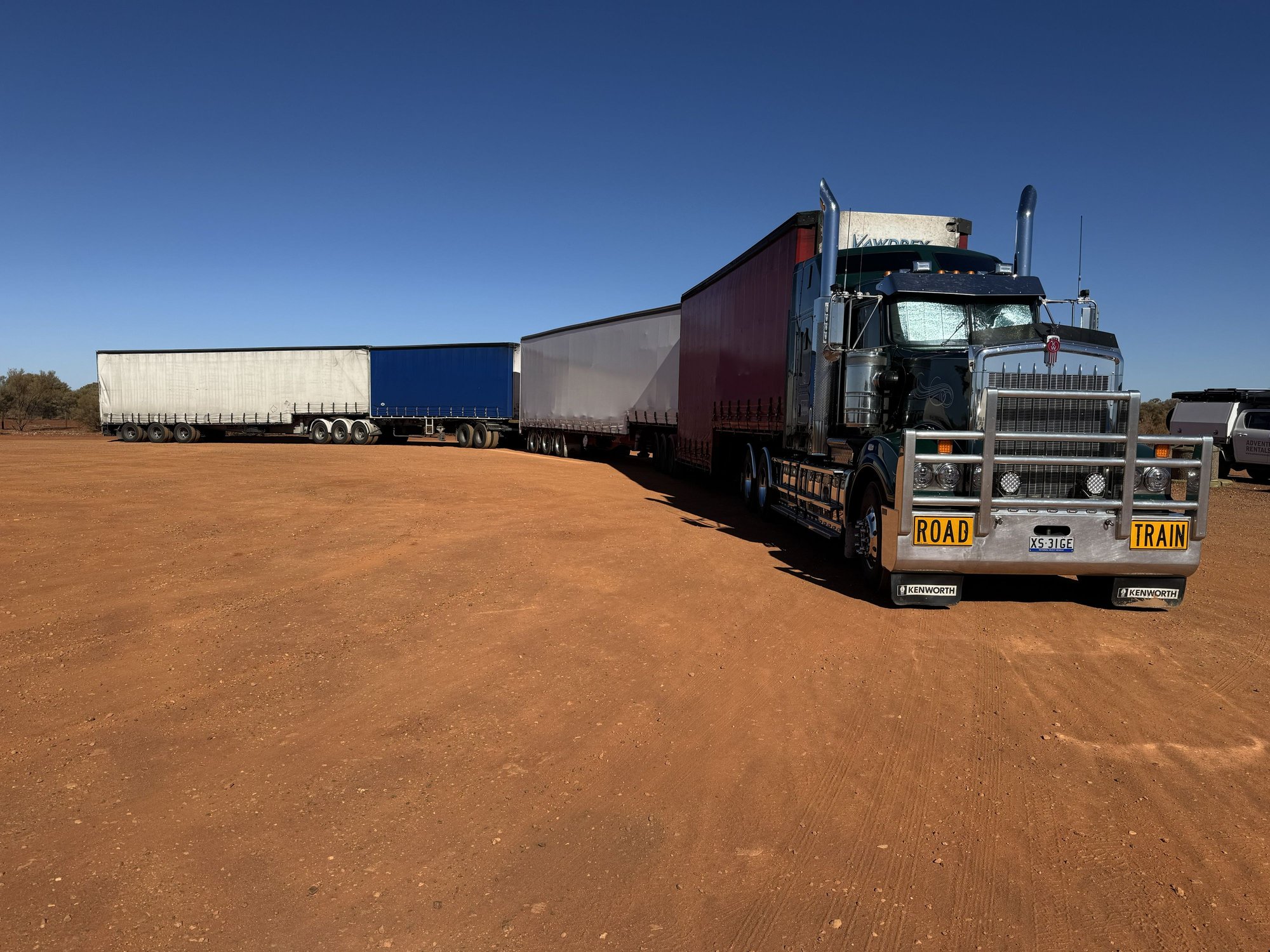 Road train rest stop. Engine was running and the windows were shaded so I think the driver was having a nap
