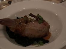 
stuffed quail on a bed of kale

