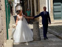 Papa leading his lovely daughter down the street