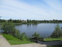 I now back onto a man made lake.
No more raking or grasscutting  or snow shoveling....but I do plant flowers about the house. ;)