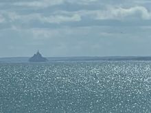 We can see a very tiny Mont St. Michel.