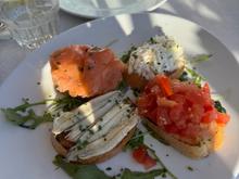 Our delicious cicchettis - a tomato bruschetta; the other 3 are all seafood - salmon, tuna and sardines