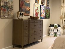 
Ottoman replace with bureau that is 40” high and could someday be used as a  convenient and back friendly changing surface for future grandbabies. Elaborate dollhouse in corner of room  also waiting for small persons to engage in play, DD approved that purchase so it is not ham-fisted attempt at message to García. 